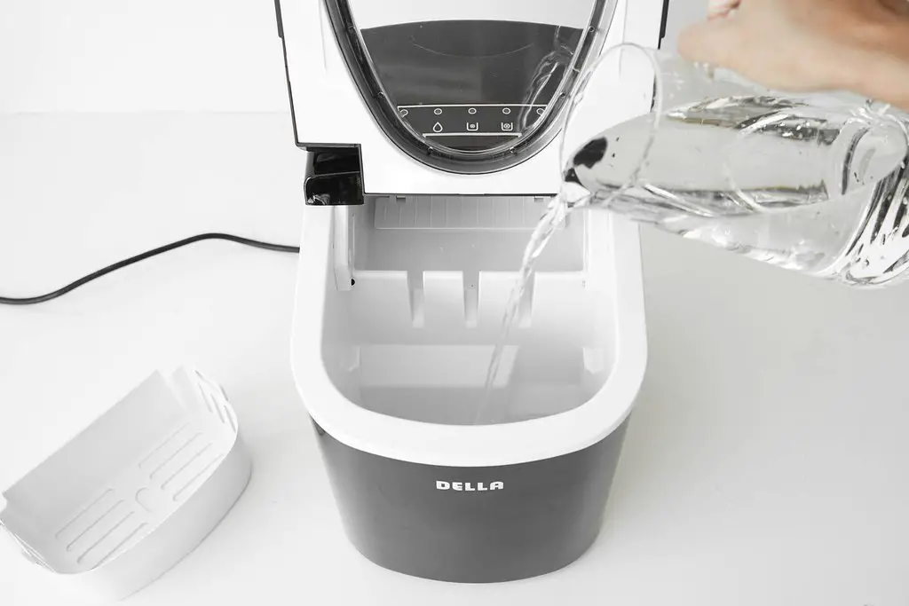 Pouring water in portable ice maker